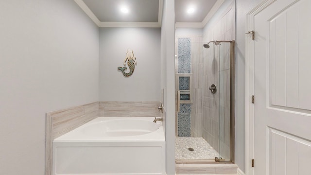 bathroom with separate shower and tub and ornamental molding