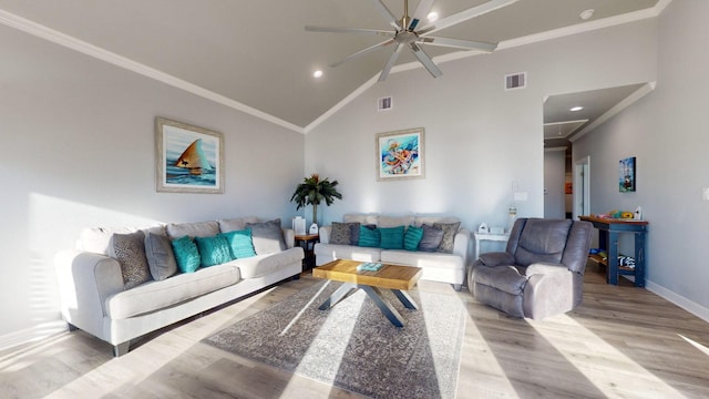 1819 Redfish Ln, Crystal Beach, TX 77650 - living area featuring a ceiling fan, wood finished floors, baseboards, vaulted ceiling, and crown molding
