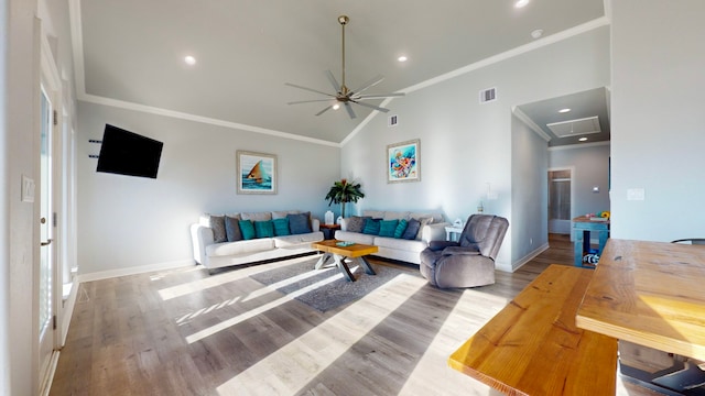 living room with hardwood / wood-style flooring, ceiling fan, crown molding, and high vaulted ceiling