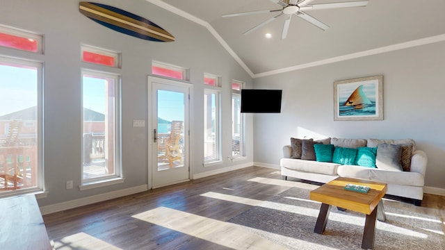 living room featuring dark hardwood / wood-style floors, ceiling fan, ornamental molding, and vaulted ceiling