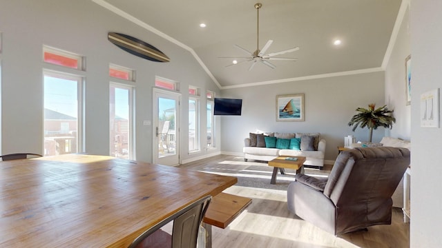 1819 Redfish Ln, Crystal Beach, TX 77650 - living area with crown molding, ceiling fan, baseboards, light wood-type flooring, and vaulted ceiling