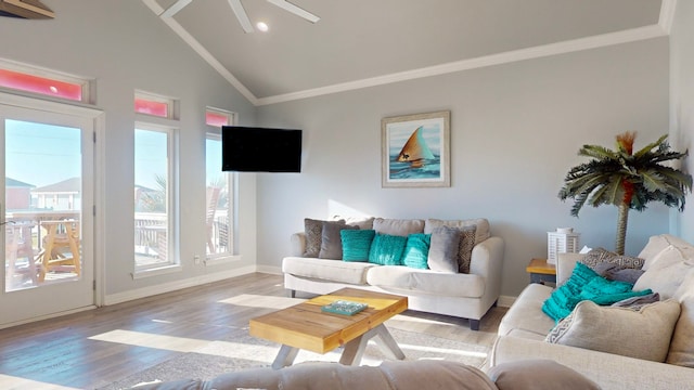 living room with light wood-type flooring, high vaulted ceiling, ceiling fan, and crown molding