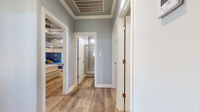1819 Redfish Ln, Crystal Beach, TX 77650 - hallway with light wood-style flooring, ornamental molding, and baseboards
