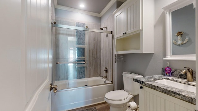 1819 Redfish Ln, Crystal Beach, TX 77650 - full bathroom featuring crown molding, toilet, enclosed tub / shower combo, and vanity