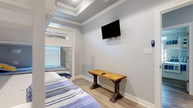 1819 Redfish Ln, Crystal Beach, TX 77650 - bedroom featuring light wood finished floors, ornamental molding, and baseboards