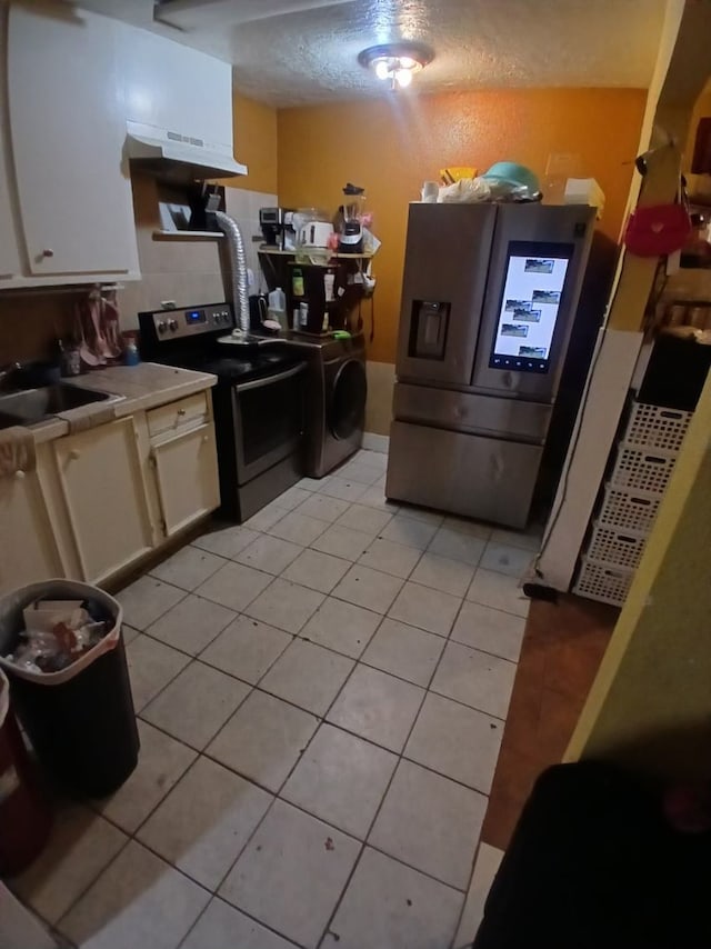 kitchen with sink, stainless steel fridge with ice dispenser, light tile patterned flooring, range with electric stovetop, and white cabinets