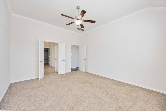 unfurnished bedroom with ceiling fan, ornamental molding, and light carpet