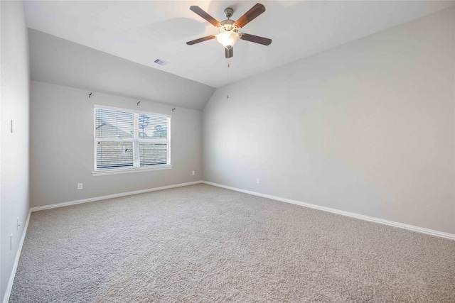 empty room with carpet flooring, ceiling fan, and lofted ceiling