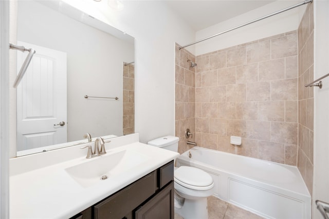 full bathroom featuring vanity, tile patterned floors, tiled shower / bath combo, and toilet