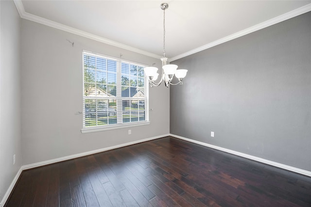 spare room with crown molding, dark hardwood / wood-style flooring, and a notable chandelier