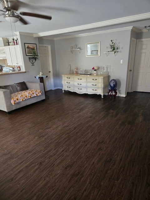 unfurnished living room featuring dark hardwood / wood-style flooring, ceiling fan, and crown molding