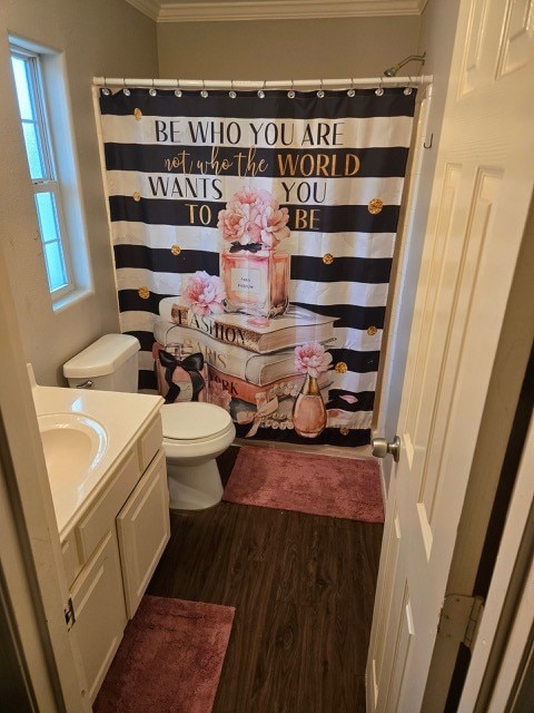 bathroom with a shower with curtain, crown molding, toilet, vanity, and hardwood / wood-style flooring