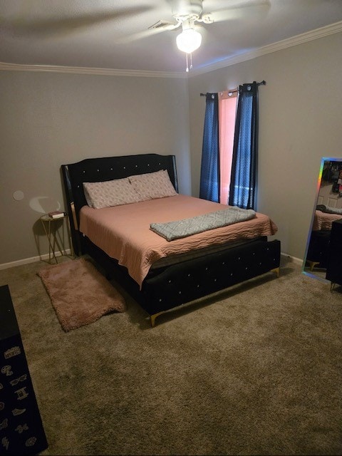 carpeted bedroom with ceiling fan and ornamental molding