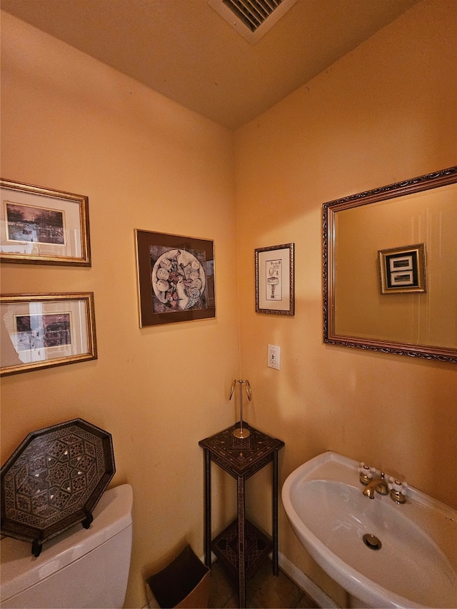 bathroom with toilet and sink