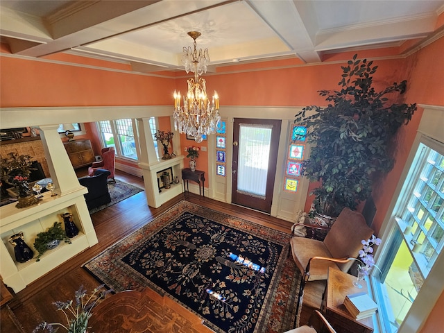 foyer entrance featuring coffered ceiling, ornate columns, ornamental molding, beamed ceiling, and wood-type flooring