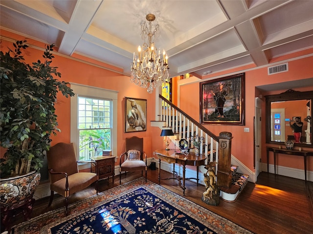 living area with hardwood / wood-style floors, beam ceiling, ornamental molding, and coffered ceiling