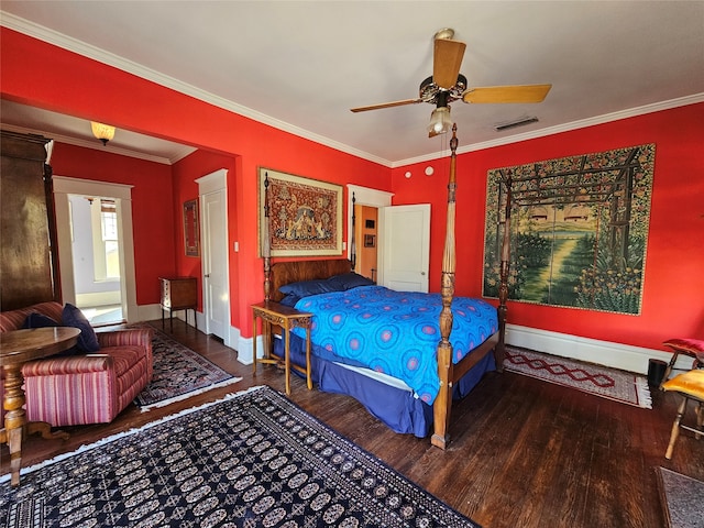 bedroom featuring ceiling fan, dark hardwood / wood-style flooring, and crown molding