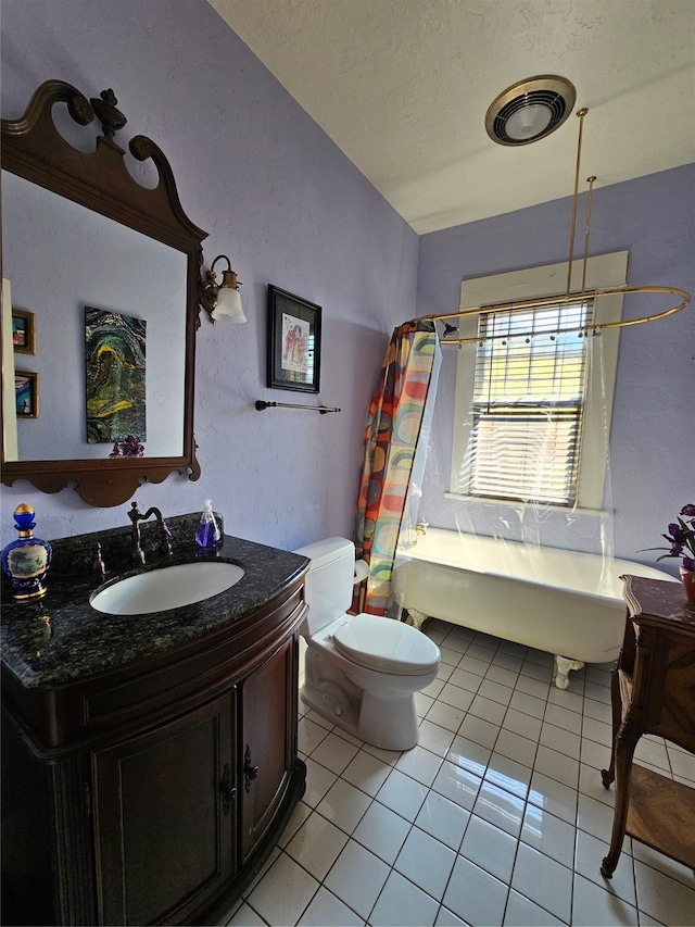 full bathroom featuring tile patterned flooring, shower / bath combination with curtain, a textured ceiling, toilet, and vanity