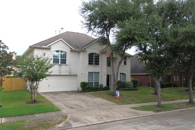 view of front facade with a front lawn and a garage