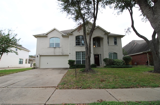 view of front of house with a front yard and a garage