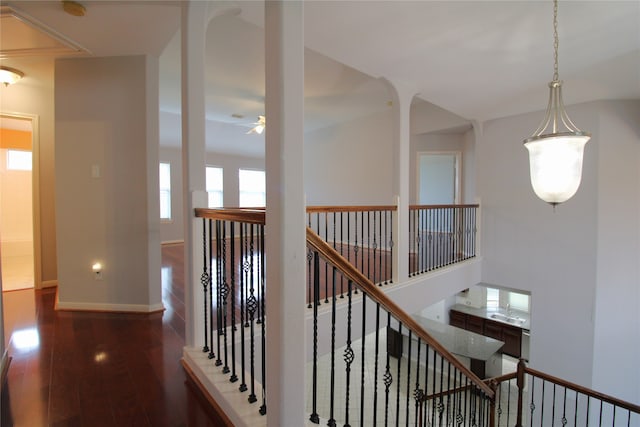 corridor with dark hardwood / wood-style flooring