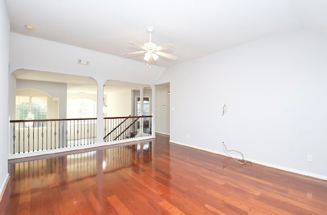 spare room with hardwood / wood-style flooring, ceiling fan, and lofted ceiling