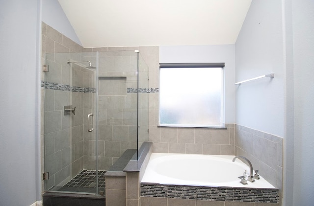 bathroom featuring plus walk in shower and lofted ceiling