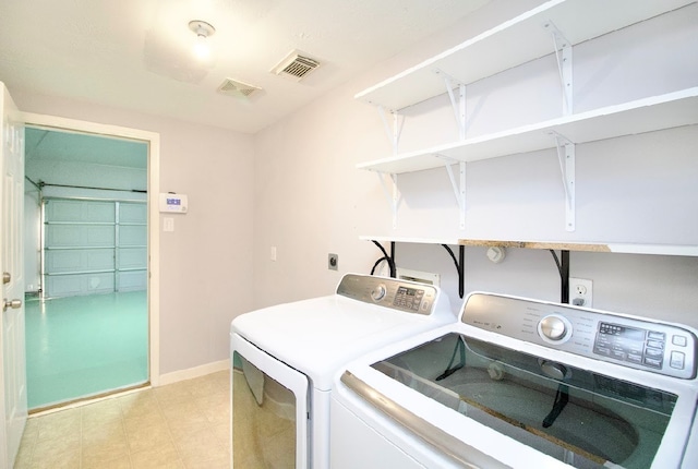 washroom with washer and clothes dryer