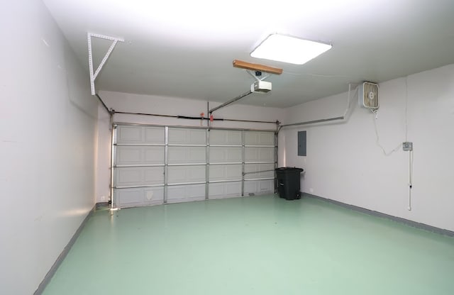 garage with electric panel and a garage door opener