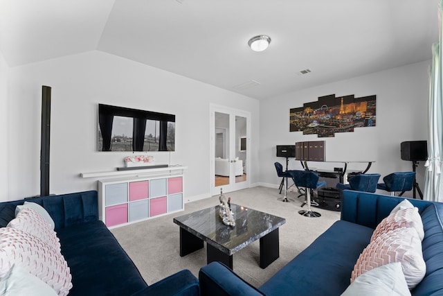 carpeted living room with vaulted ceiling