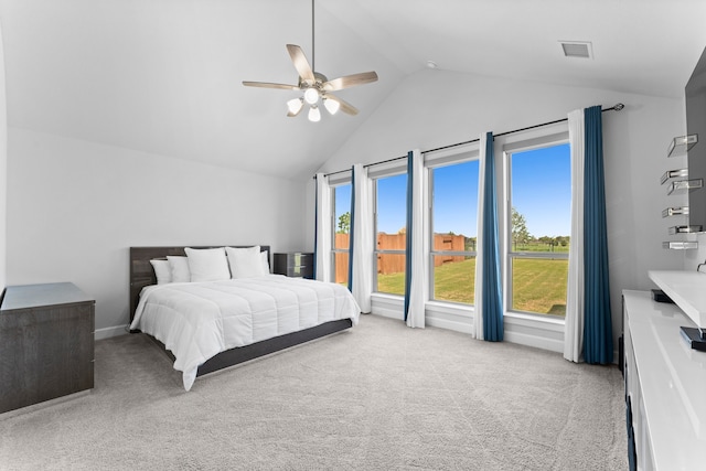 carpeted bedroom with ceiling fan and lofted ceiling