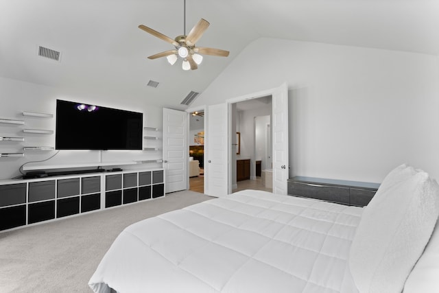 bedroom featuring light colored carpet, vaulted ceiling, and ceiling fan