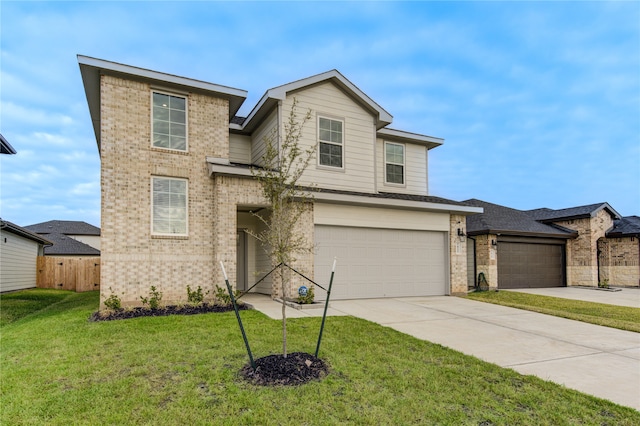 view of front facade with a front yard and a garage