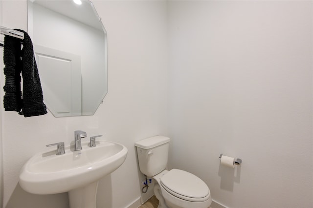 bathroom with toilet and sink