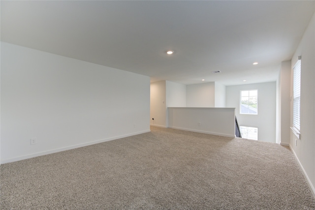 empty room featuring light colored carpet