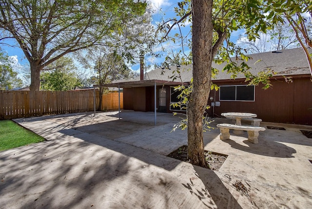 back of house with a patio