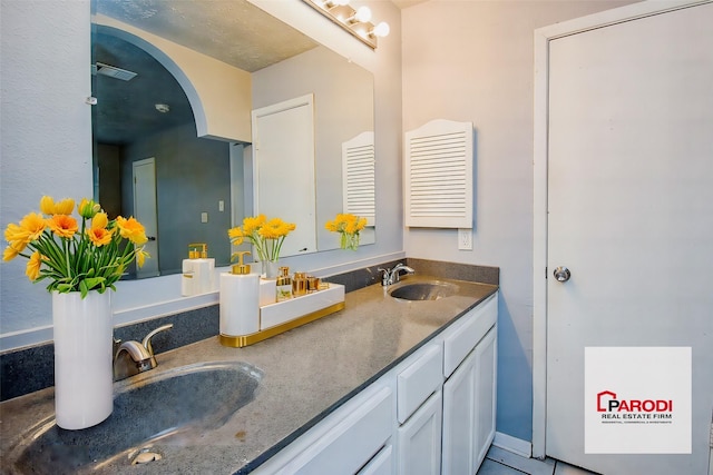 bathroom with vanity and tile patterned flooring