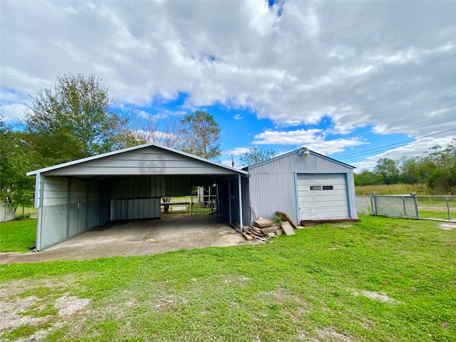 view of outbuilding featuring a yard and a carport