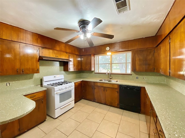 kitchen featuring dishwasher, light tile patterned flooring, sink, and gas range gas stove