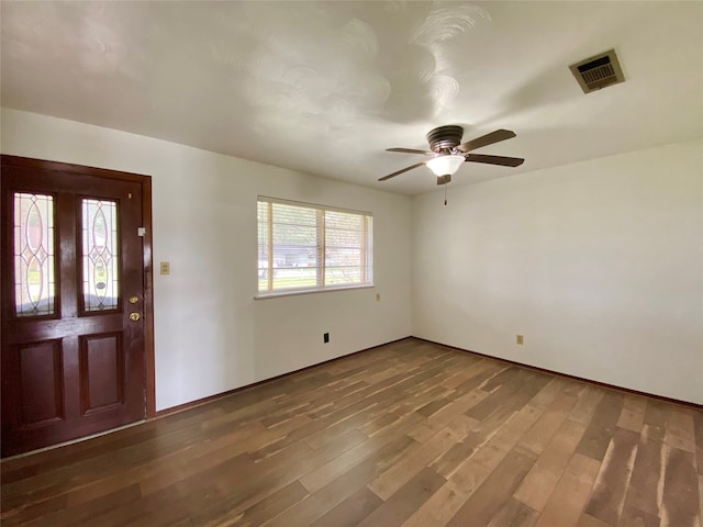 foyer entrance featuring ceiling fan and dark wood-type flooring