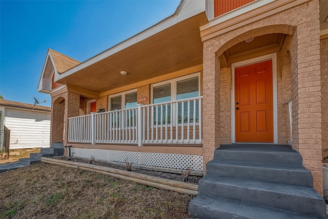 property entrance featuring covered porch