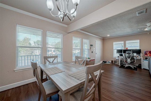 dining room with ceiling fan with notable chandelier, a textured ceiling, crown molding, and dark wood-type flooring