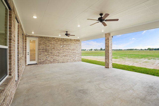 view of patio featuring a rural view and ceiling fan