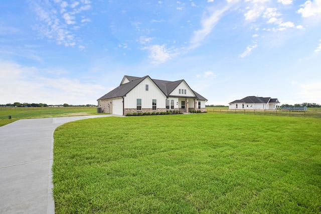 view of front of house with a garage and a front lawn