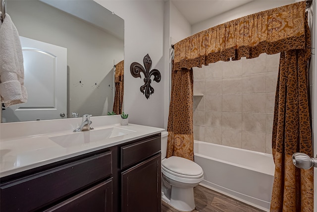 full bathroom featuring toilet, shower / tub combo with curtain, vanity, and hardwood / wood-style flooring