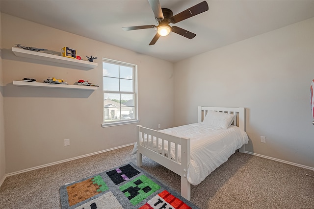 carpeted bedroom with ceiling fan