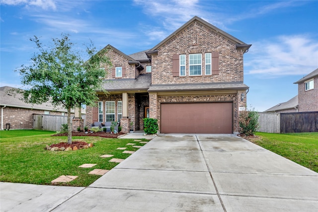 craftsman inspired home featuring a garage and a front yard