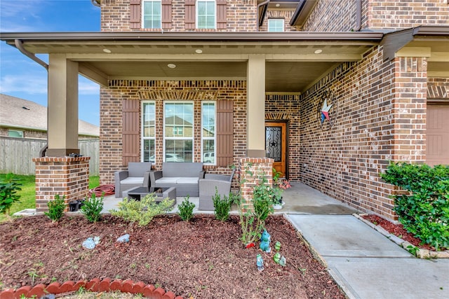 entrance to property featuring an outdoor hangout area