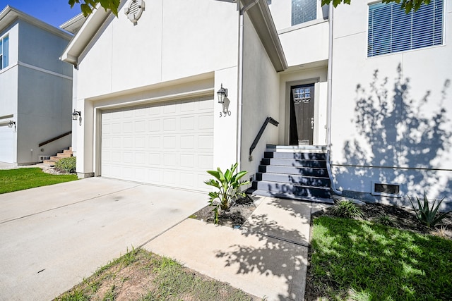 doorway to property featuring a garage