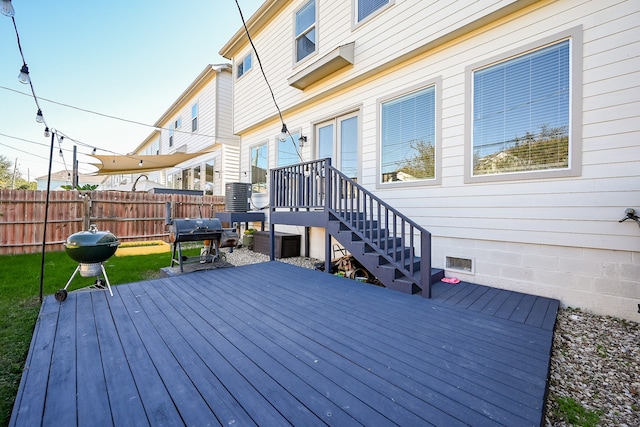 wooden terrace with a grill